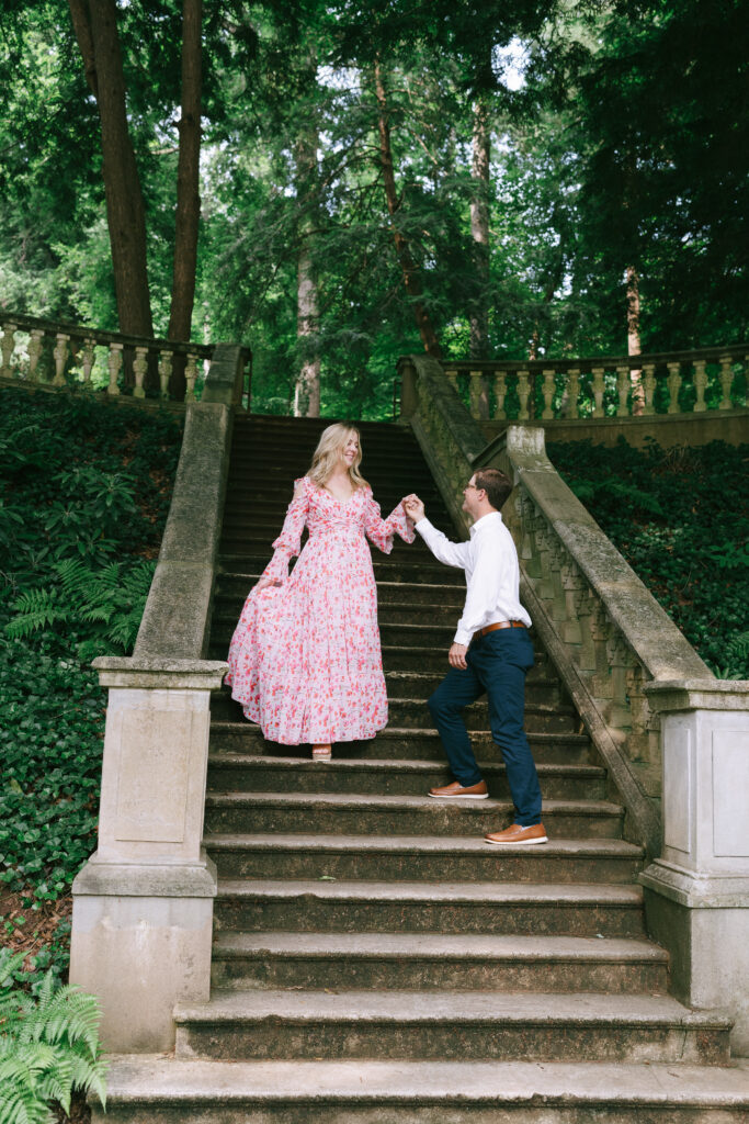 Couple walking down stone staircase in Catorwoolford Gardens