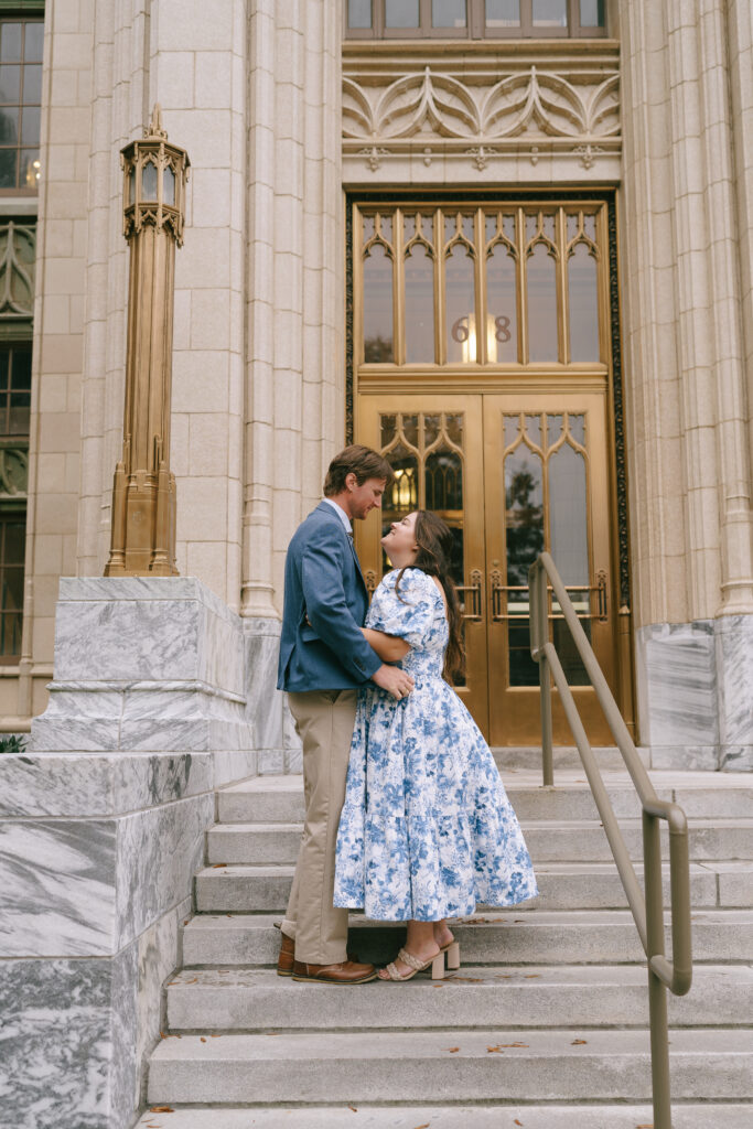 Couple embracing and gazing at one another on the steps of the Georgia Courthouse steps