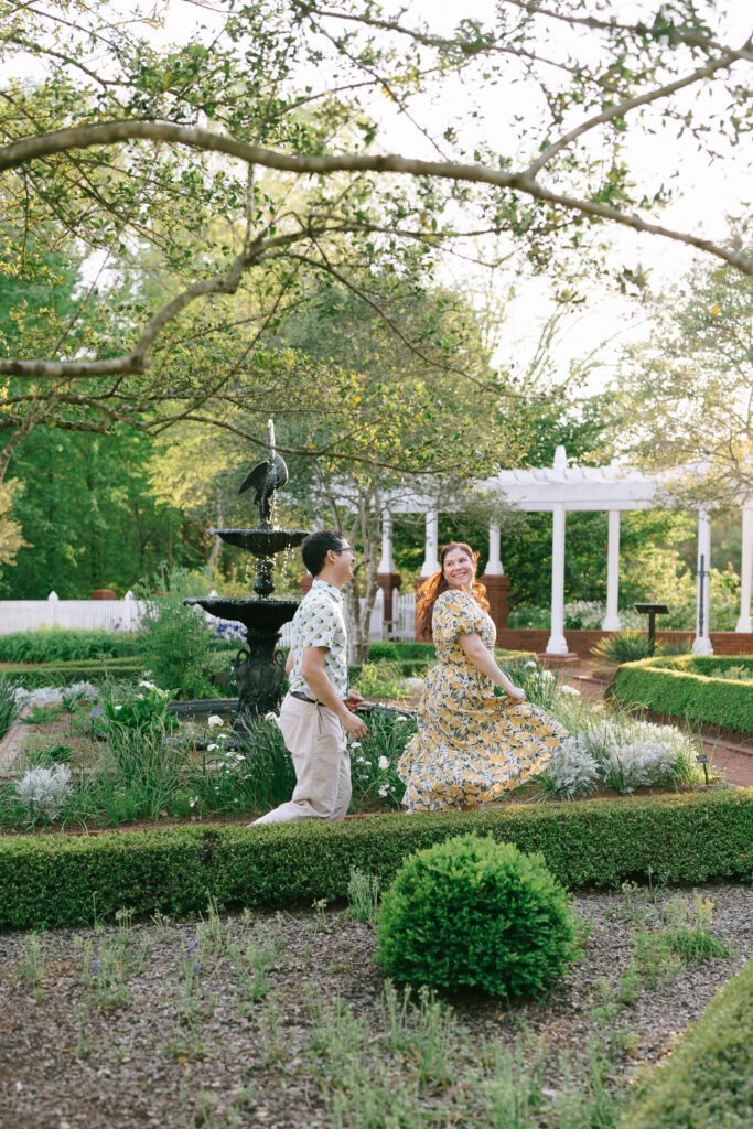 Couple running through gardens at the State Botanical Gardens of Georgia