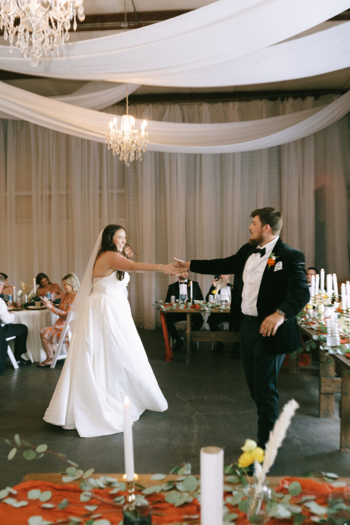 Bride and groom dancing.