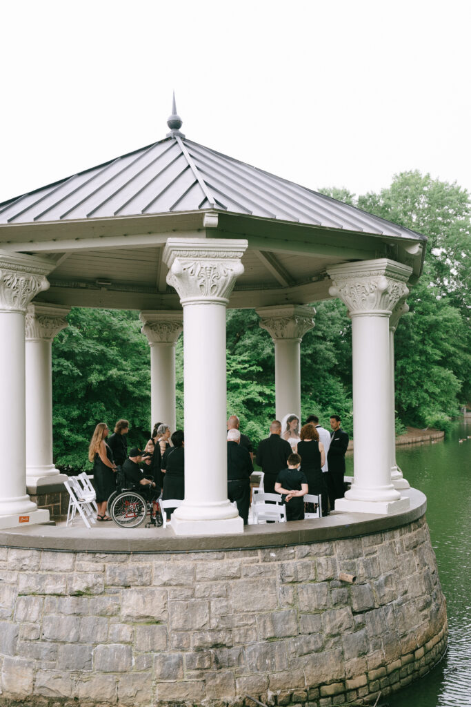 Family and friends gathered for ceremony under pavilion in Piedmont Park.