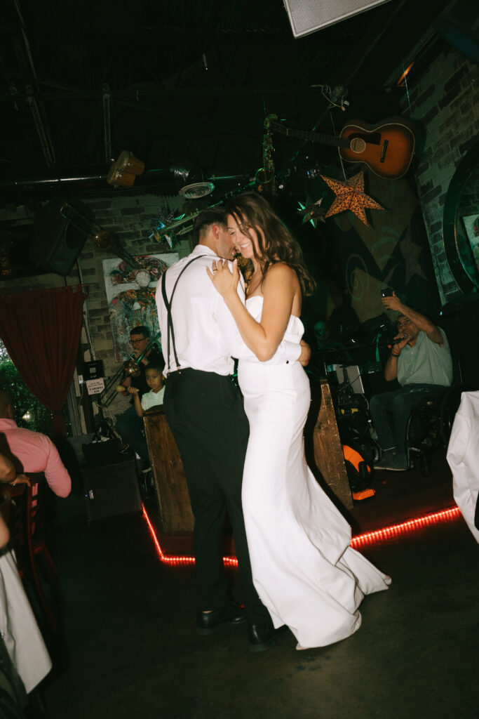 Bride and groom dancing at reception.