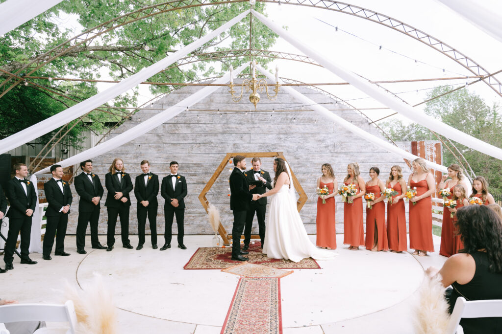 Bride and groom standing at the alter at The Venue at the Bluffs.