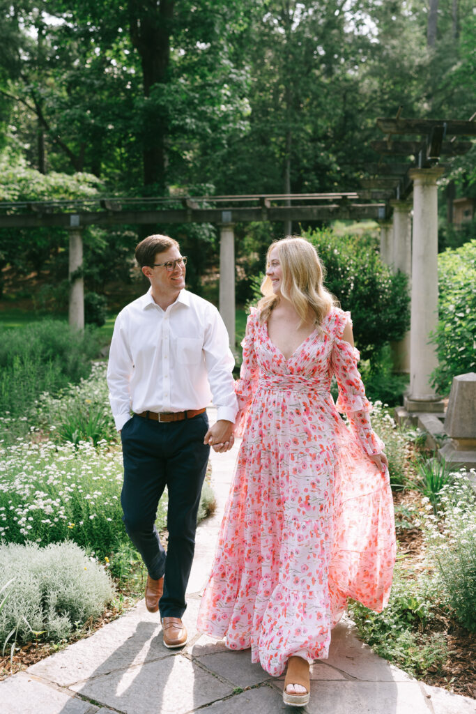 Couple walking through gardens at Cator Woolford gardens